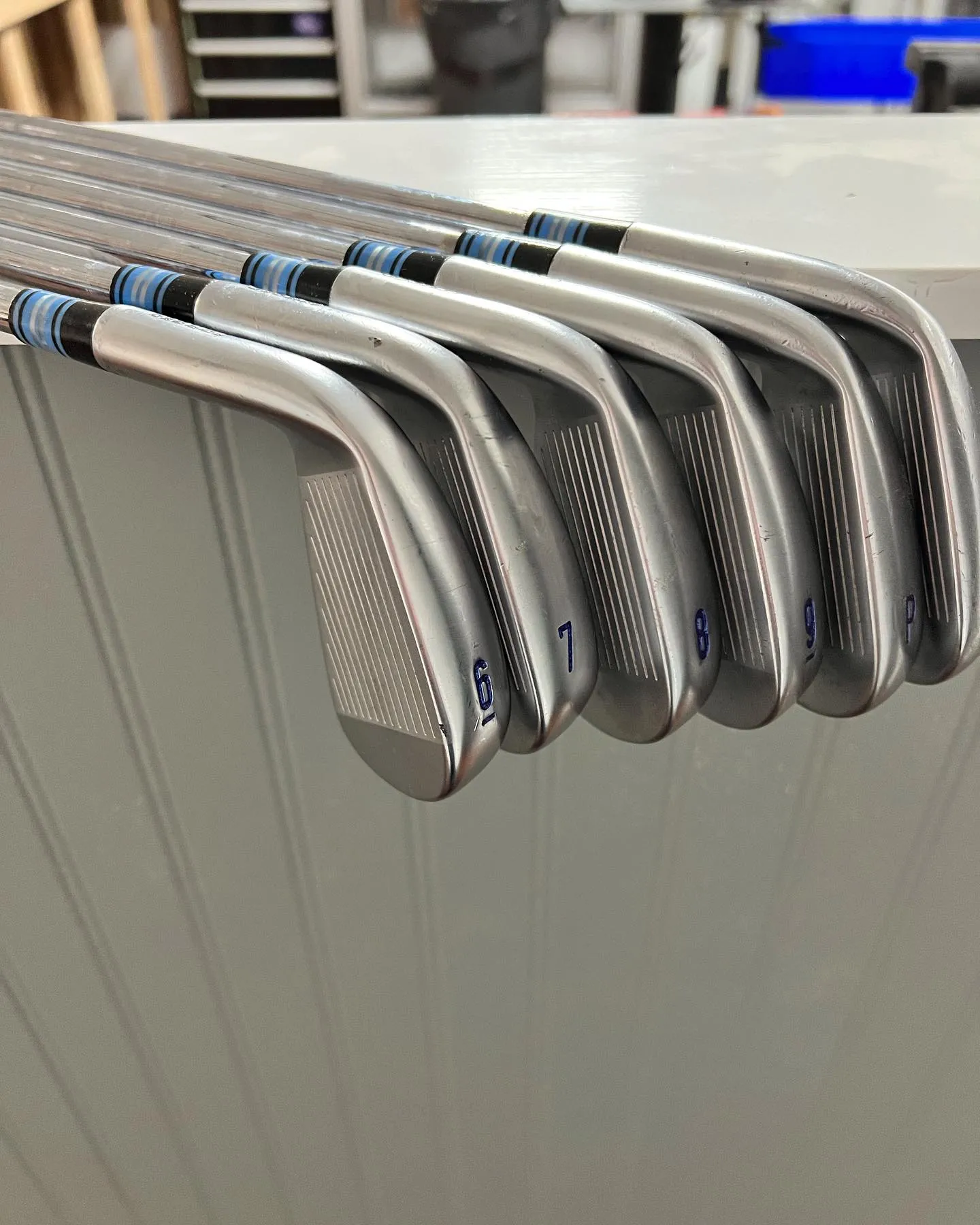 A set of fitting irons with blue shaft bands