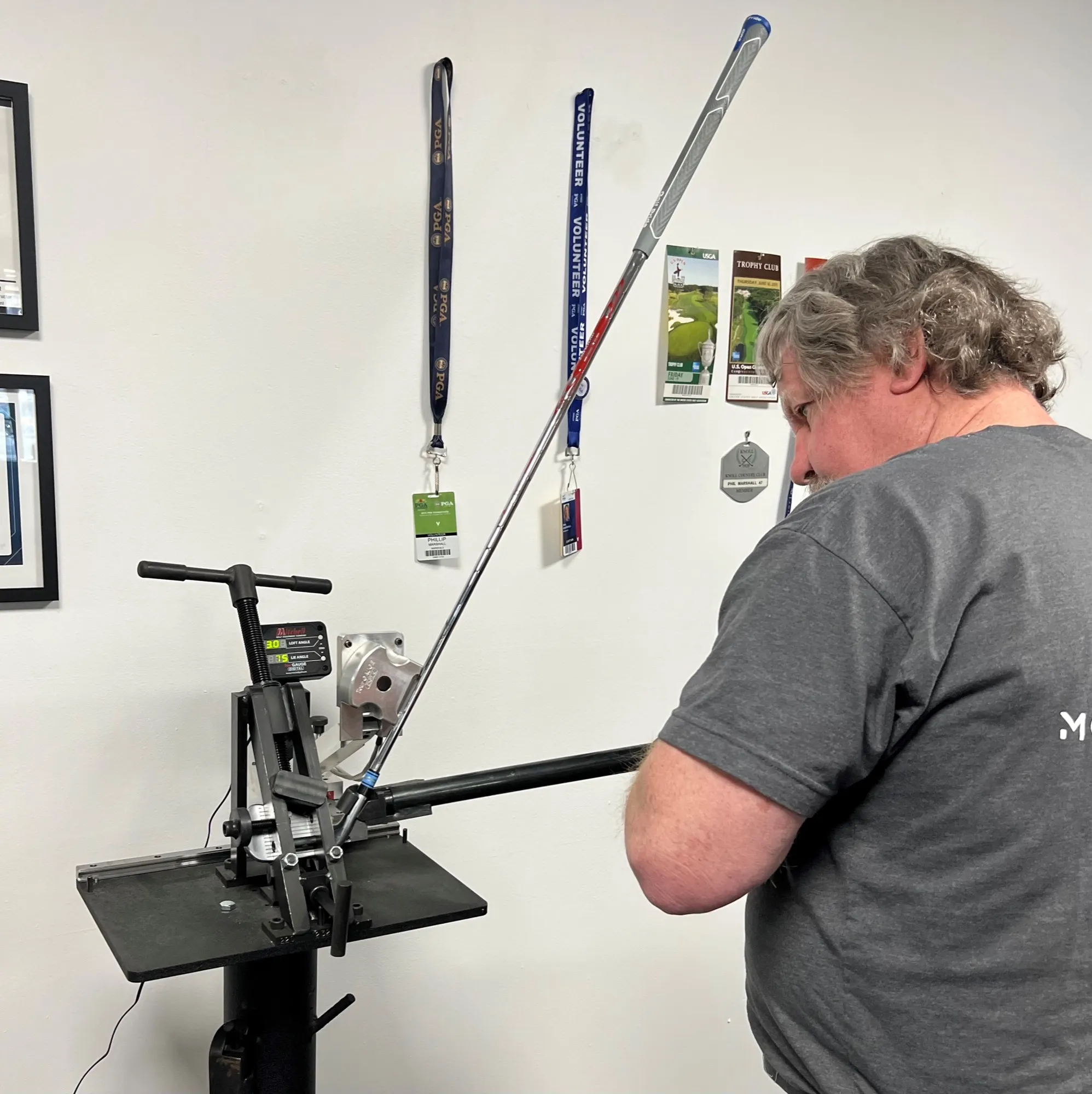 Phil Marshall checking a club on the Mitchell loft and lie machine